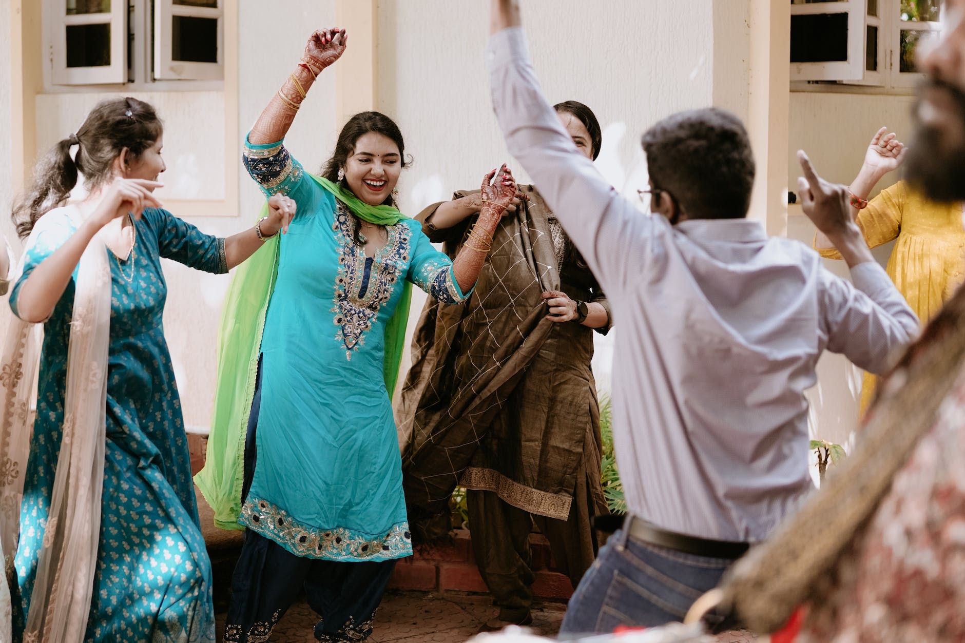 indian people in traditional clothing dancing